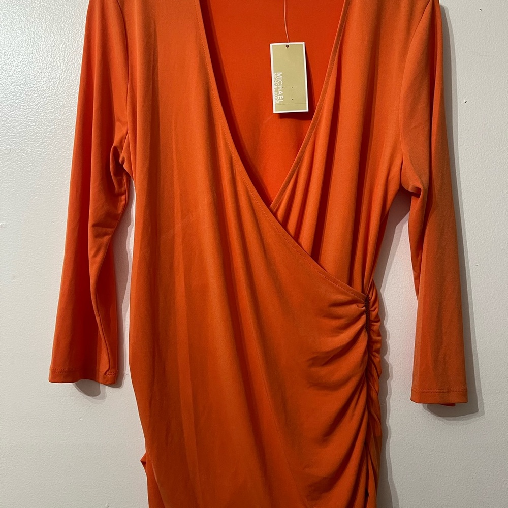 Michael Kors tangerine blouse. Brand new with tags. Size Medium